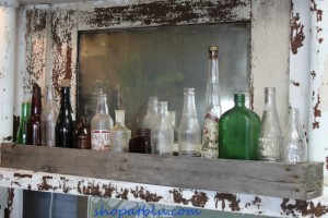 Shopatblu rustic chippy mantle with bottledecor