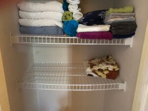The Blue Building Antiques Shopatblu January declutter linen closet bent shelf