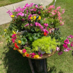 shopatblu decorate porch wheel barrow flowers